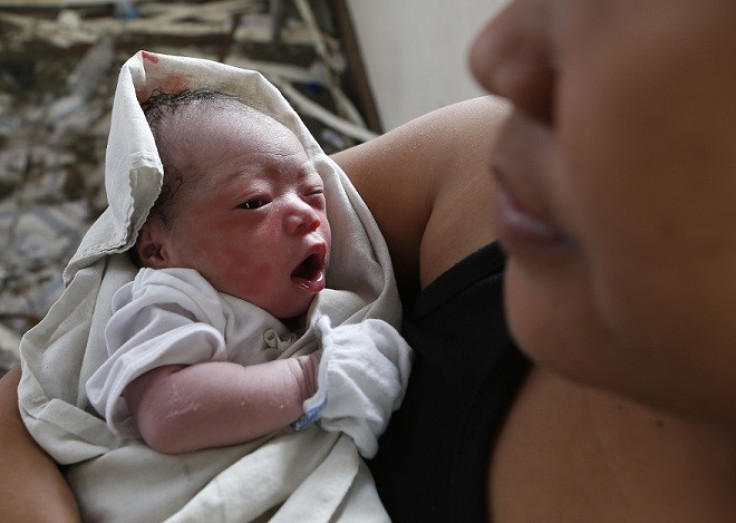 A baby born in the aftermath of Typhoon Yolanda recuperates at a makeshift birthing clinic in Tacloban city, central Philippines PIC: Reuters