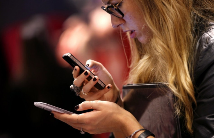 A woman checking out smartphones