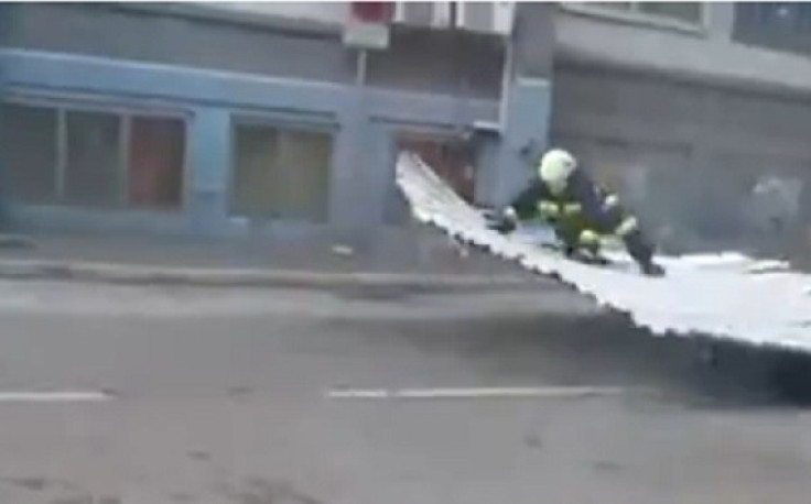 Firefighter lifts off during high winds in Rijeka, Croatia PIC: Liveleak