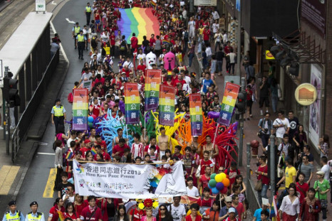 Participants hold a giant rainbow flag during the annual gay pride parade in Hong Kong November 9, 2013. Participants from lesbian, gay, bisexual and transgender communities took to the street on Saturday to demonstrate for their rights. REUTERS/Tyrone Si