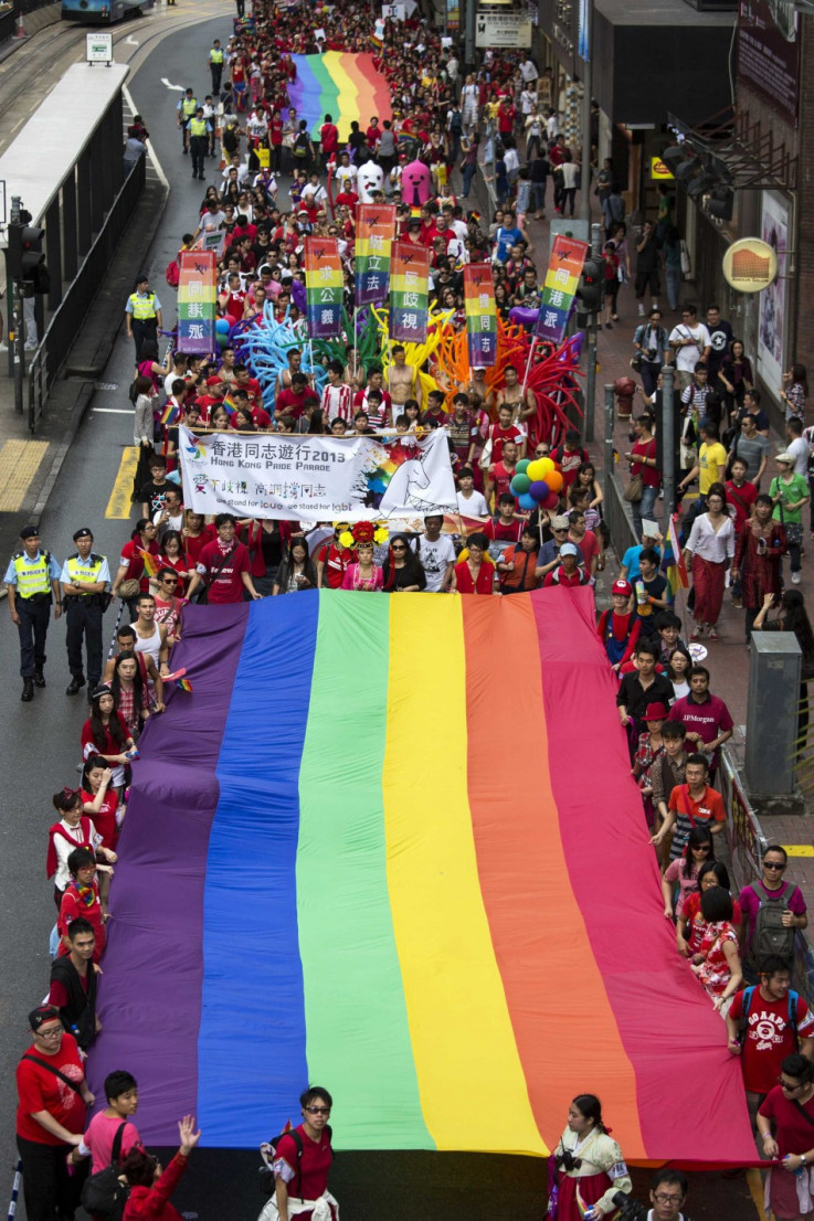 Participants hold a giant rainbow flag during the annual gay pride parade in Hong Kong November 9, 2013. Participants from lesbian, gay, bisexual and transgender communities took to the street on Saturday to demonstrate for their rights. REUTERS/Tyrone Si