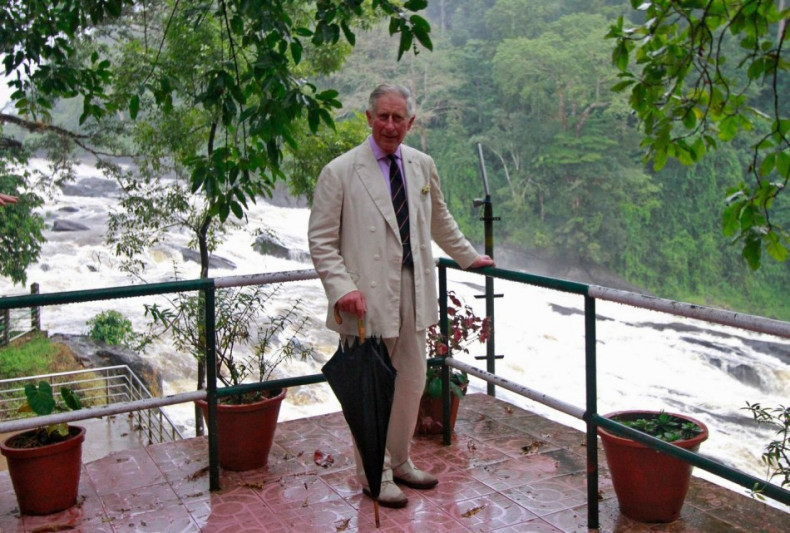 Prince Charles poses for pictures against the backdrop of Vazhachal waterfalls at Thrissur district in Kerala. (Photo: Reuters)