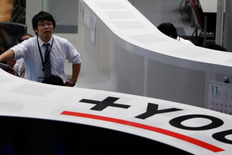 Asian markets trade higher on 14 November