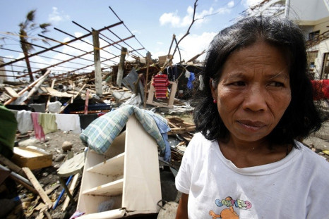 Woman Ponders Typhoon Haiyan Damage