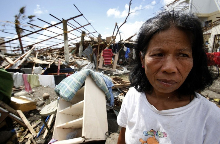 Woman Ponders Typhoon Haiyan Damage