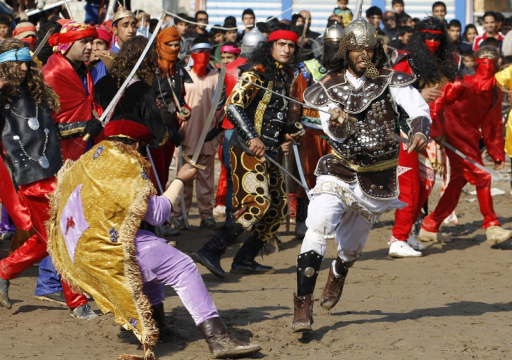 Local actors dressed as ancient warriors re-enact a scene from the 7th century battle of Kerbala in Baghdad's Sadr City. (Photo: REUTERS/Thaier Al-Sudani)
