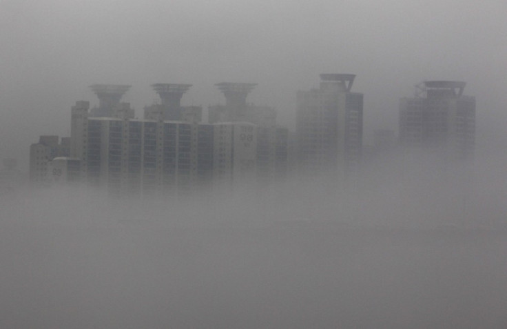 An apartment complex in Seoul shrouded in fog in July, 2011.