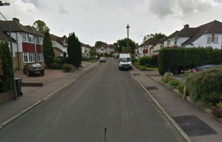 A body was found in a well by gardeners in a front garden in Surrey. (Pic: Google).