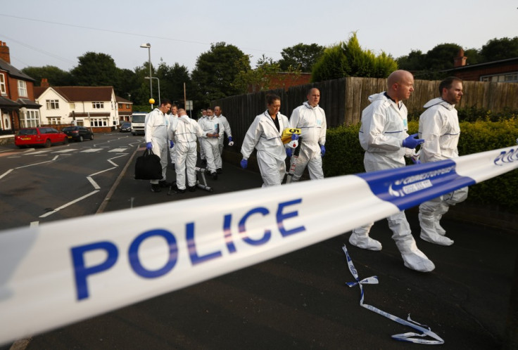 Specialist police officers recovered a body from the bottom of a well in Surrey.