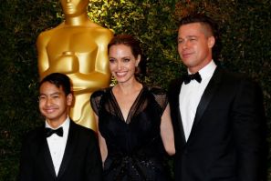 Angelina Jolie and partner Brad Pitt and son Maddox arrive at the fifth Annual Academy of Motion Picture Arts and Sciences Governors Awards in Hollywood November 16, 2013.  (Reuters)