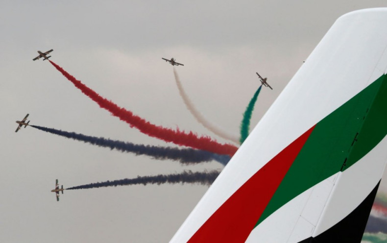 Al Fursan, the aerobatics demonstration team of the United Arab Emirates Air Force, performs during the Dubai Airshow November 17, 2013. (Reuters)