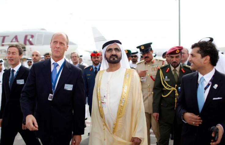 United Arab Emirates' Prime Minister and Ruler of Dubai Sheikh Mohammed bin Rashid al-Maktoum (front, 2nd R) walks with EADS Chief Executive Tom Enders (2nd L) while on a tour at the opening of the Dubai Airshow November 17, 2013.  (Reuters)