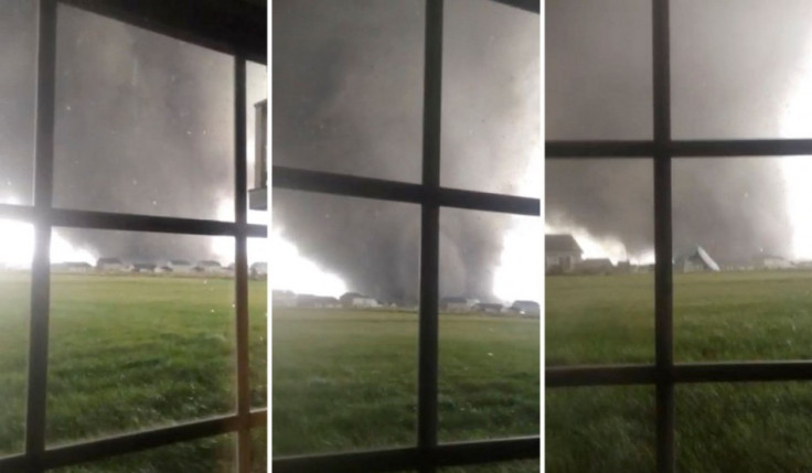 Combination of three video stills shows an active tornado as it touches down in Washington, Illinois. (Photo: Reuters)