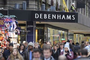 People walk past Debenhams department store on Oxford Street, in central London. Retailers have started offering discount ahead of Thanksgiving, Black Friday and Christmas. (Photo: REUTERS/Ki Price)