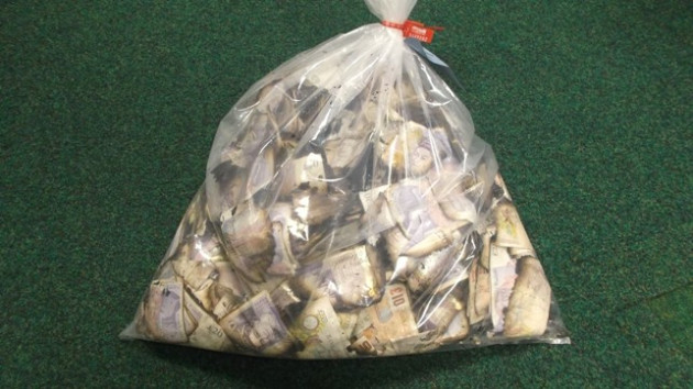 Filthy lucre: Dirty notes hauled from river Spalding PIC: Lincolnshire police Filthy lucre: Dirty notes hauled from river Spalding PIC: Lincolnshire police