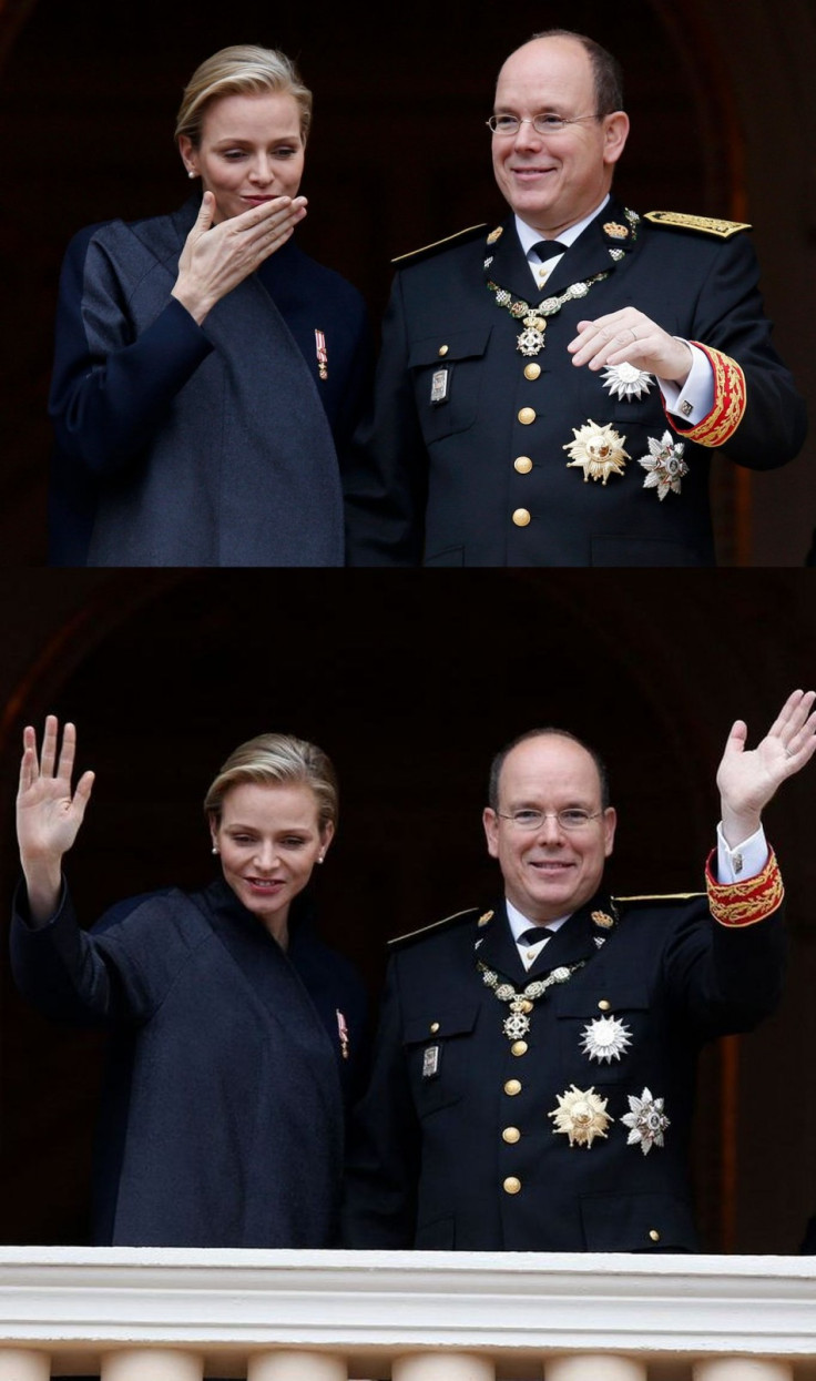 Princess Charlene and Prince Albert II of Monaco blow a kiss to well-wishers wave from the Palace balcony. (Photo: REUTERS/Eric Gaillard)