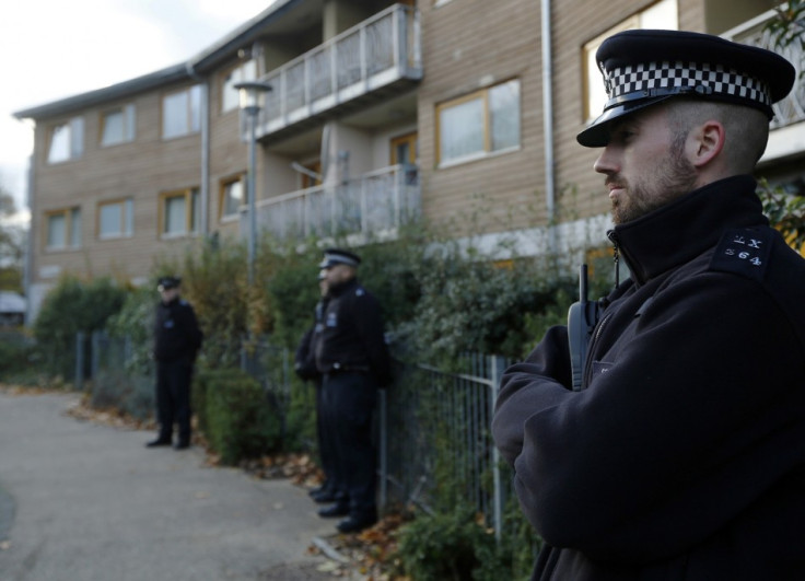 Police stand guard outside Peyton Place, South London.