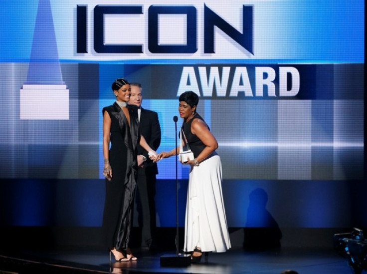 Rihanna accepts the Icon Award from her mother Monica Fenty as presenter Bill Maher stands by