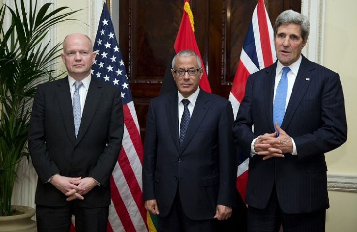 US Secretary of State John Kerry (R) speaks to the media as British Foreign Secretary William Hague (L) and Libyan Prime Minister Ali Zeidan stand with him at the Winfield House, the residence of the US Ambassador to Britain, on 24 November, 2013. (Photo: