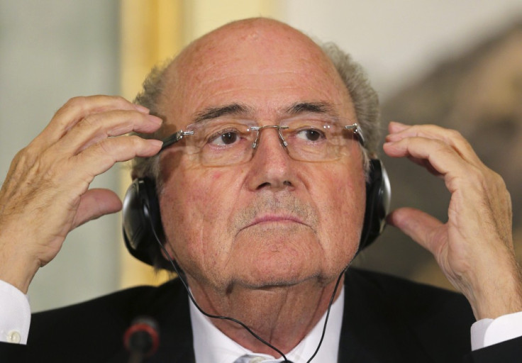 FIFA President Sepp Blatter speaks during a news conference in Doha