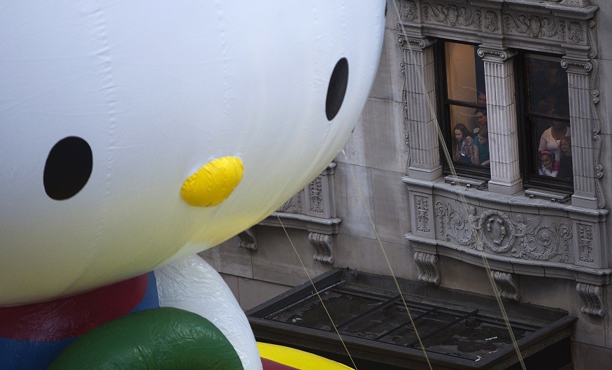 Huge size of Hello Kitty inflatable is clear in 6th Avenue during the Thanksgiving Day Parade in New York