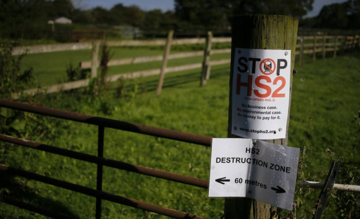 An anti high speed rail project (HS2) banner is seen nailed to a fence post near the village of Pickmere, northern England