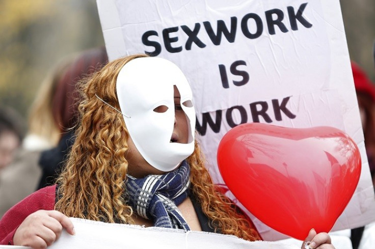 A sex worker in Paris demonstrates against plans to fine people who use prostitutes’ services. (Reuters)