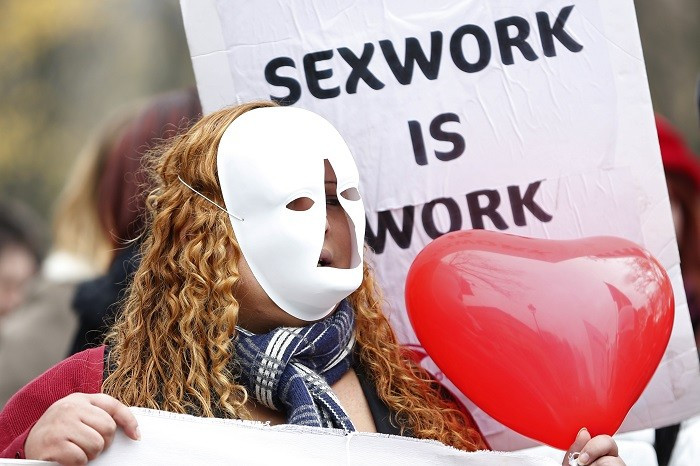 A sex worker in Paris demonstrates against plans to fine people who use prostitutes’ services. (Reuters) A sex worker in Paris demonstrates against plans to fine people who use prostitutes’ services. (Reuters)