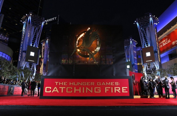People wait at the premiere of The Hunger Games: Catching Fire in Los Angeles, California. The sequel starring Jennifer Lawrence is tipped to make $400m in the US alone. (Photo:Reuters)