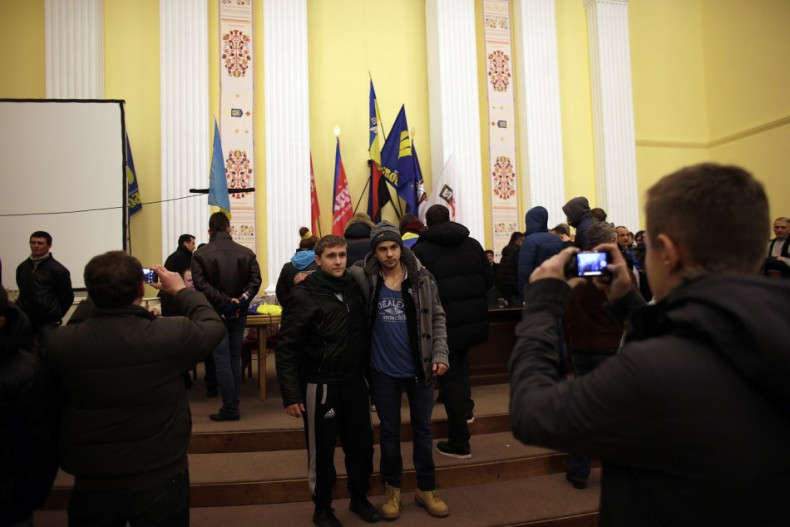 People take pictures at a meeting hall inside Kiev's city hall December 1, 2013