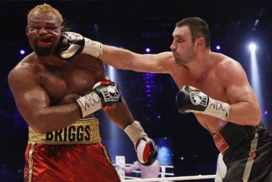 WBC boxing champion Vitali Klitschko (R) of Ukraine lands a punch on Shannon Briggs of the U.S.