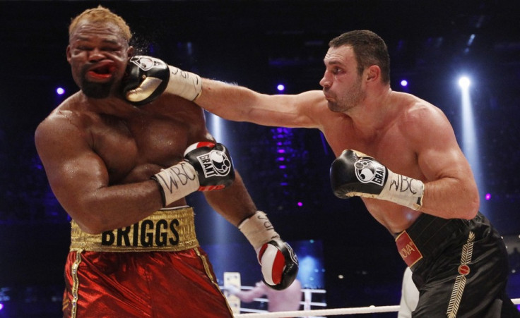 WBC boxing champion Vitali Klitschko (R) of Ukraine lands a punch on Shannon Briggs of the U.S.