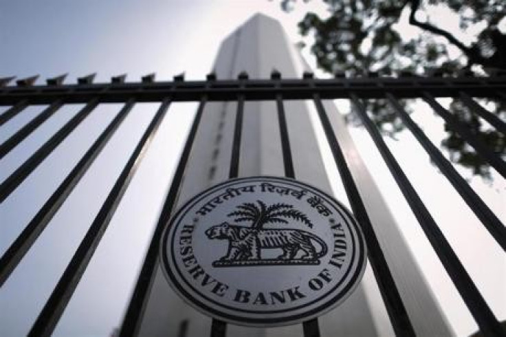 The Reserve Bank of India (RBI) seal is pictured on a gate outside the RBI headquarters in Mumbai October 29, 2013.
