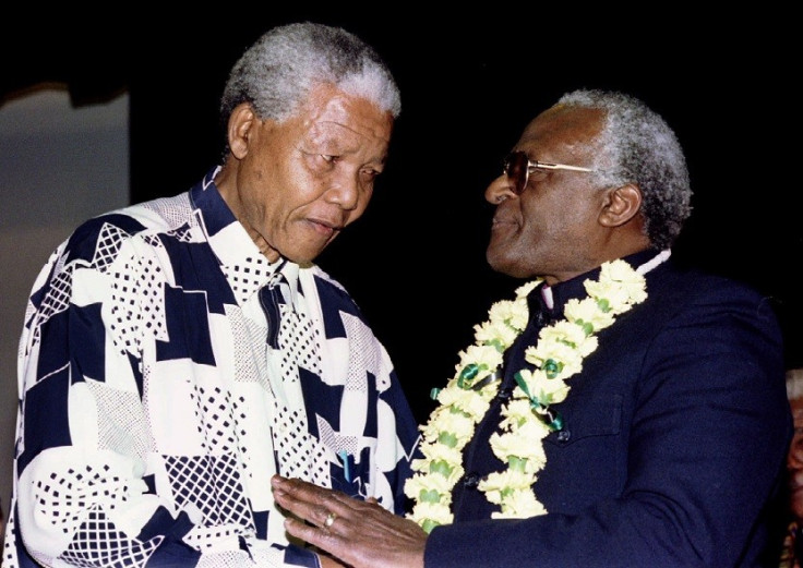 Nelson Mandela wearing a shirt to bring out the vari-focal tint in Desmond Tutu's glasses PIC: Reuters