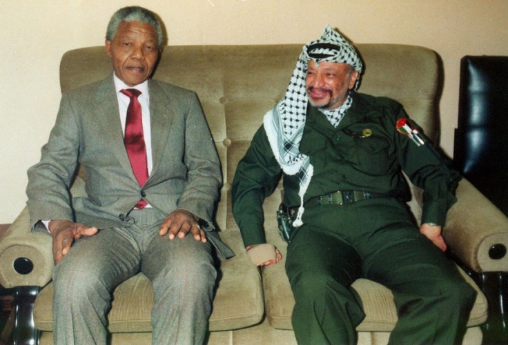 Nelson Mandela in a suit with Yasser Arafat PIC: Reuters