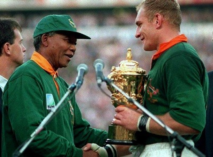 Nelson Mandela hands over the William Webb Ellis Cup to Springbok captain Francois Pienaar after South Africa's victory in the 1995 World Cup (Reuters)