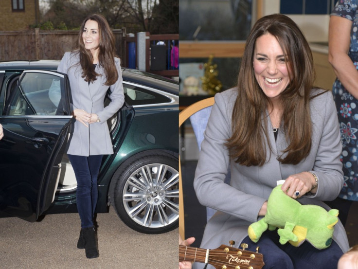 Kate wore blue skinny jeans and Reiss' gray coat for the visit. (Photo: REUTERS/Bradley Page)