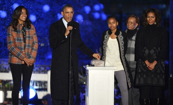 Back Obama and the first family light the national Christmas tree in a ceremony that dates back to the 1920s. (Reuters)