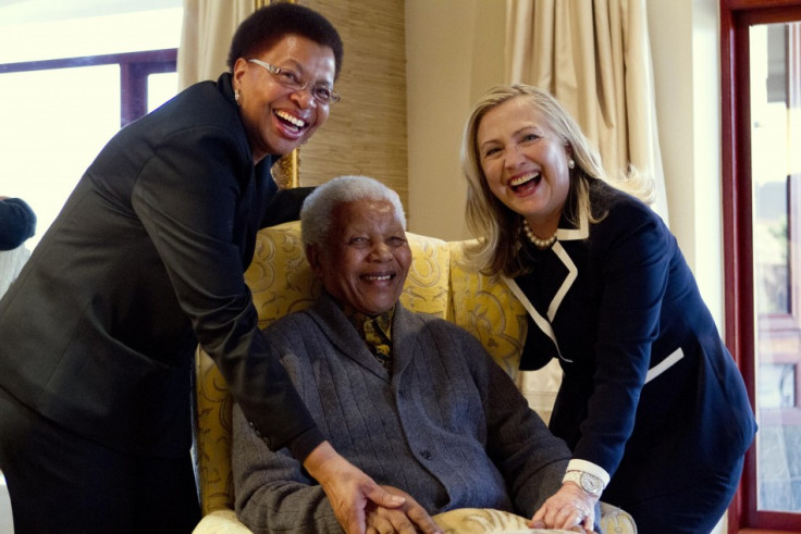 US Secretary of State Hillary Clinton (R) with Nelson Mandela, former president of South Africa, and his wife Graca Machel (L).