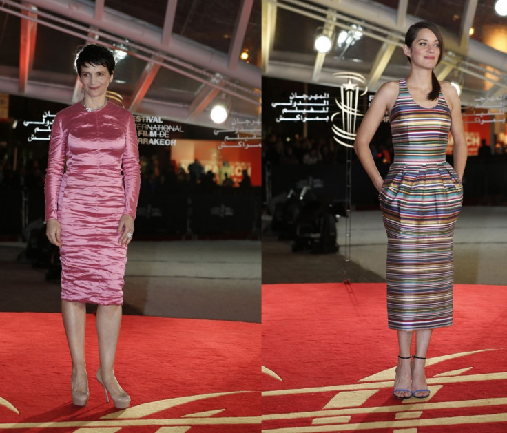French actresses: Juliette Binoche (L) wears shiny pink dress while Marion Cotillard looks chic in oddly striped dress. (Reuters)