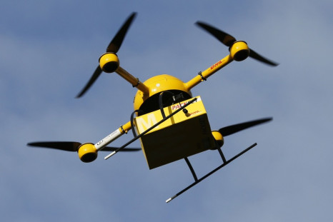 A prototype "parcelcopter" of German postal and logistics group Deutsche Post DHL flies at 100m above ground, its maximum approved height, in Bonn December 9, 2013. (REUTERS/Wolfgang Rattay)