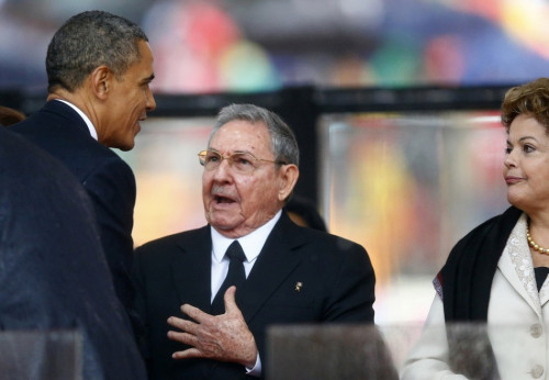 U.S. President Barack Obama (L) greets Cuban President Raul Castro (C) before giving his speech U.S. President Barack Obama (L) greets Cuban President Raul Castro (C) before giving his speech