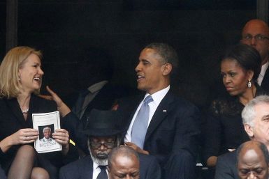 Helle Thorning-Schmidt and Barak Obama share a joke at Nelson Mandela's memorial, but Michelle's not laughing PIC: Reuters
