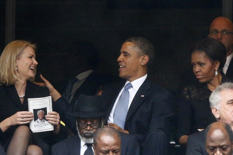 Helle Thorning-Schmidt and Barak Obama share a joke at Nelson Mandela's memorial, but Michelle's not laughing PIC: Reuters
