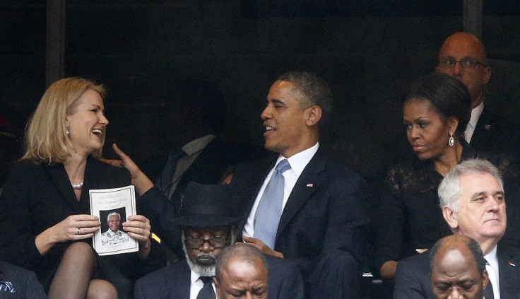 Helle Thorning-Schmidt and Barak Obama share a joke at Nelson Mandela's memorial, but Michelle's not laughing PIC: Reuters