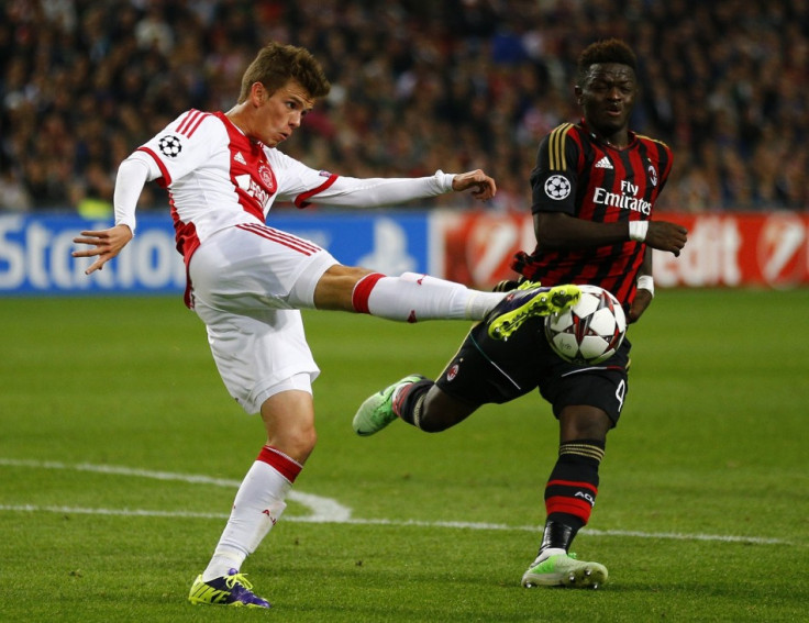 Ajax Amsterdam's Lucas Andersen (L) fights for the ball with AC Milan's Sulley Muntari (R) during their Champions League soccer match