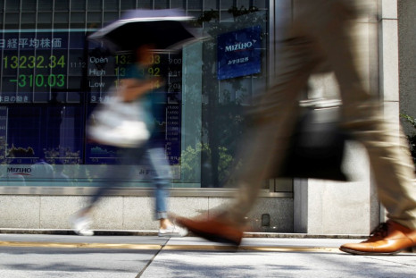 Asian markets trade lower on 12 December