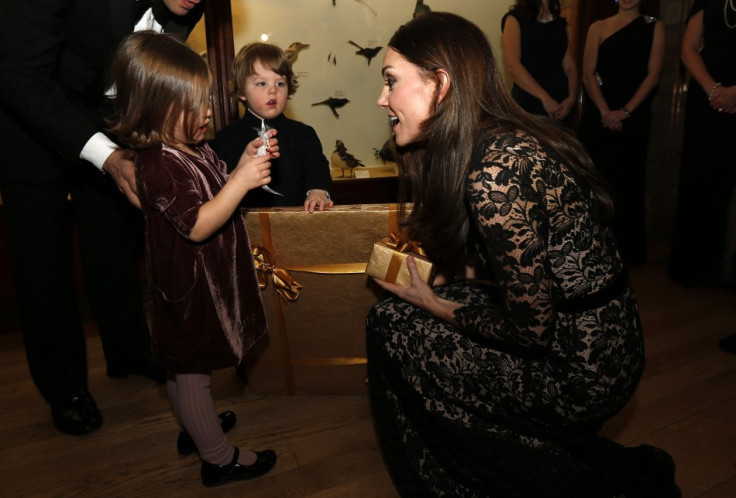 The Duchess of Cambridge, talks with Jessica (L) and her brother Francis Geffen, twin children of production company's CEO, before the screening. (Reuters)