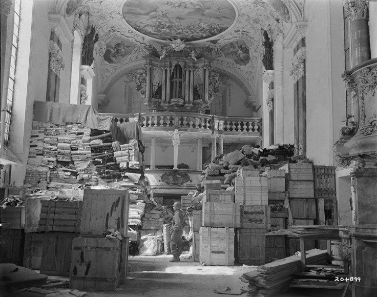 A US soldier views art stolen by the Nazi regime and stored in a church at Ellingen, Germany April 24, 1945. (Photo: Reuters)