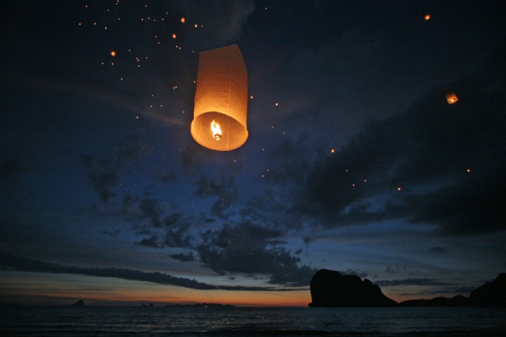 Lanterns are released during a ceremony to commemorate the first anniversary of the Indian Ocean tsunami on Pak Meng beach, Thailand December 26, 2005. (Reuters)